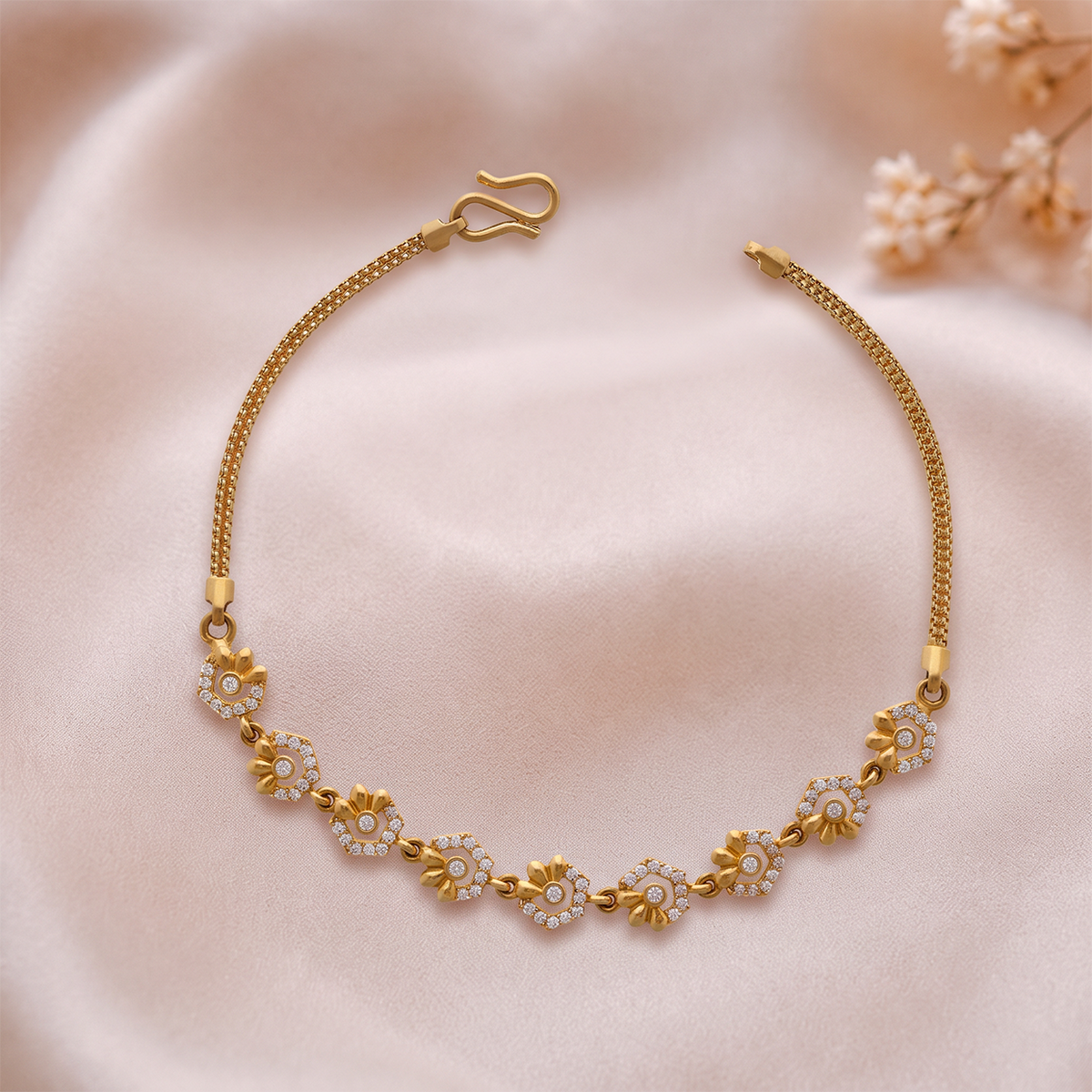 Gold Bracelet with Floral and Leaf Motifs